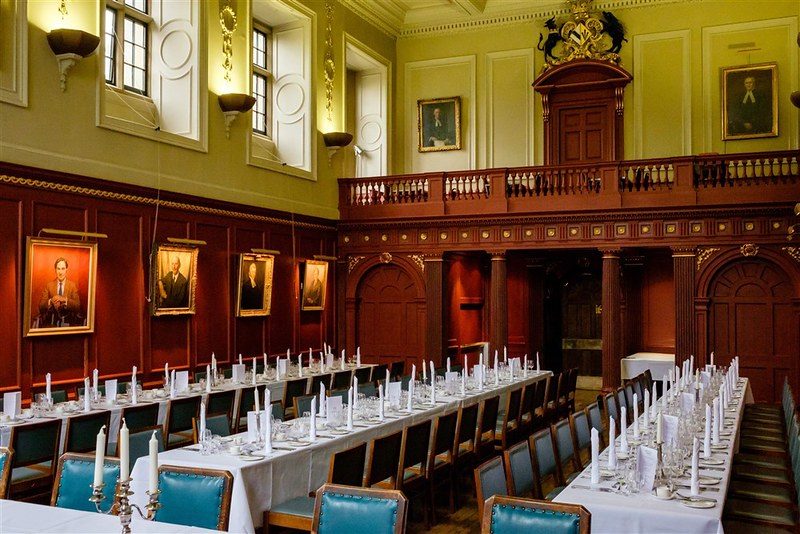 A formal dinner in a college dining hall